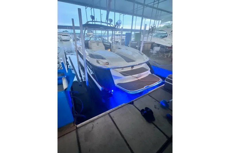 Slide: The Image of 2007 Cobalt 343 boat docked with blue underwater lights. - 46