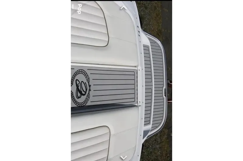 Slide: The Image of Top view of a 2007 Cobalt 343 boat deck with logo and sleek design. - 47