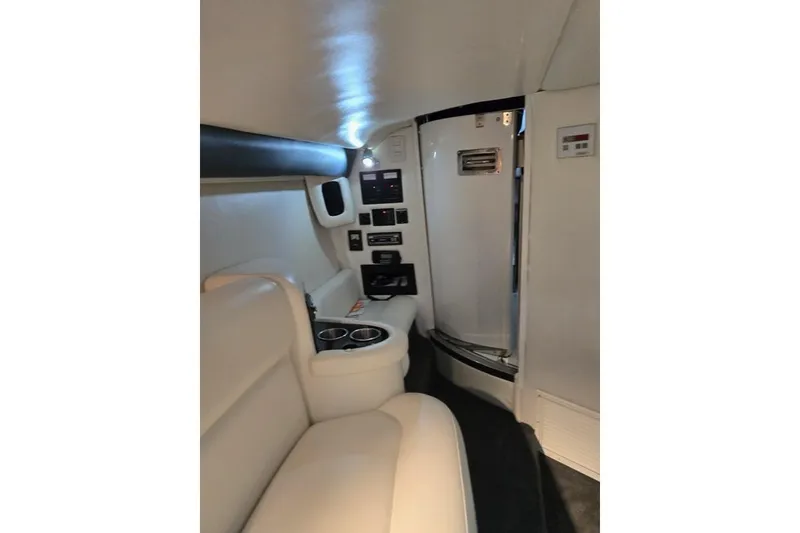 Slide: The Image of Luxurious interior of a 2007 Cobalt 343 boat with white leather seating. - 52