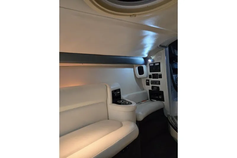 Slide: The Image of Luxurious interior of a 2007 Cobalt 343 boat with white leather seating. - 54
