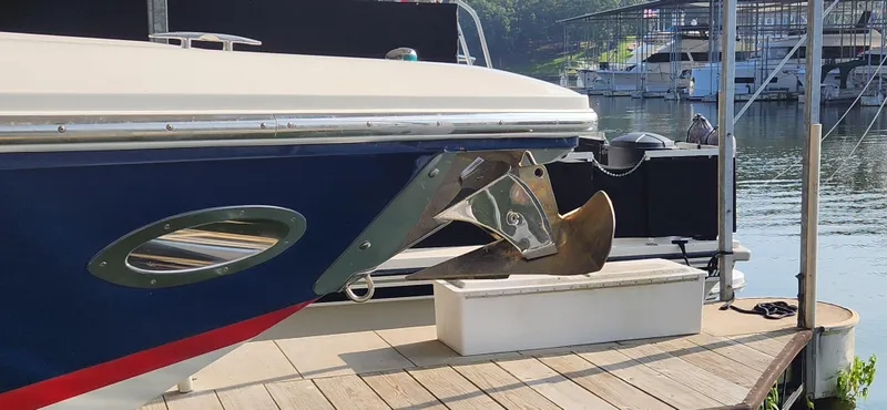 Slide: The Image of 2007 Cobalt 343 boat docked, showing anchor and hull details. - 9