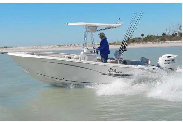 The Image of 2018 Sea Chaser 24 HFC boat docked in a marina, featuring a sleek design. - 1