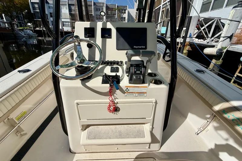Slide: The Image of 2018 Sea Chaser 24 HFC boat console with steering wheel and Raymarine electronics. - 15