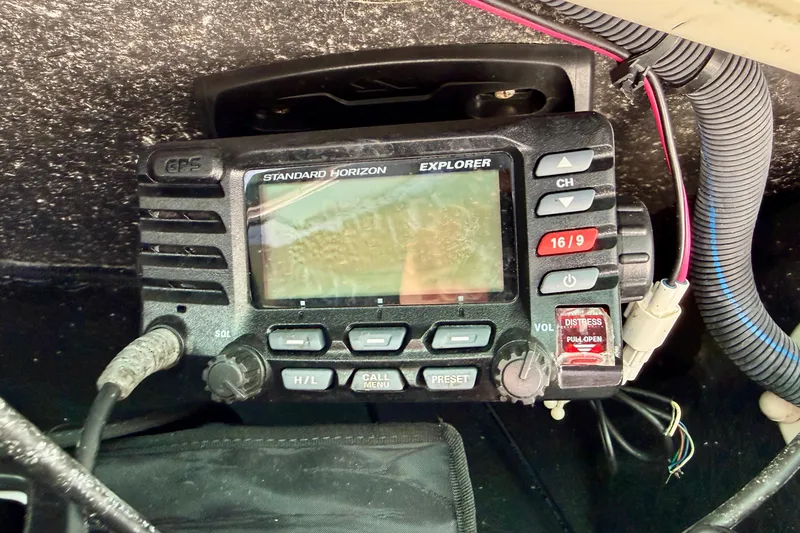 Slide: The Image of Standard Horizon Explorer radio on 2018 Sea Chaser 24 HFC boat dashboard. - 19