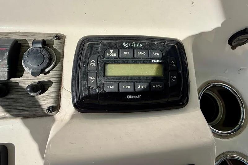 Slide: The Image of Infinity audio system on 2018 Sea Chaser 24 HFC boat dashboard with Bluetooth connectivity. - 20