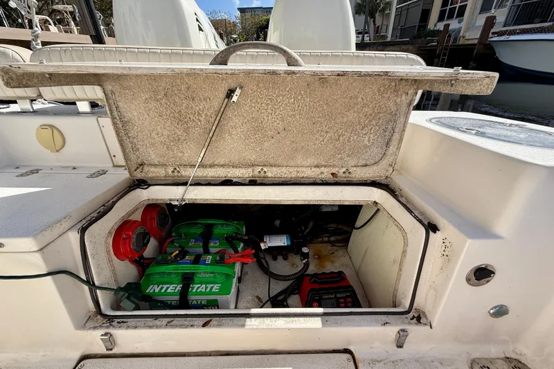 Slide: The Image of 2018 Sea Chaser 24 HFC boat battery compartment with Interstate batteries and wiring. - 27