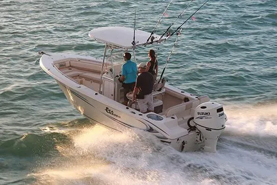 Slide: The Image of 2018 Sea Chaser 24 HFC boat docked, featuring dual outboard engines. - 3
