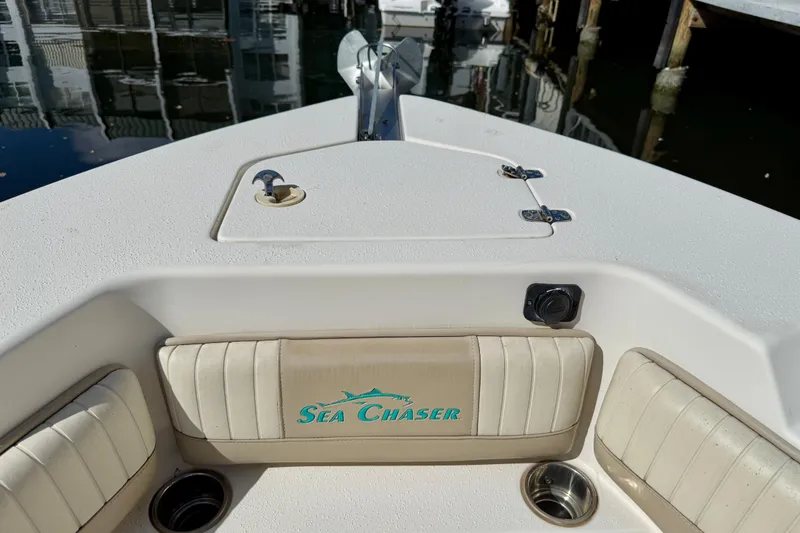 Slide: The Image of 2018 Sea Chaser 24 HFC boat interior with logo and seating. - 6