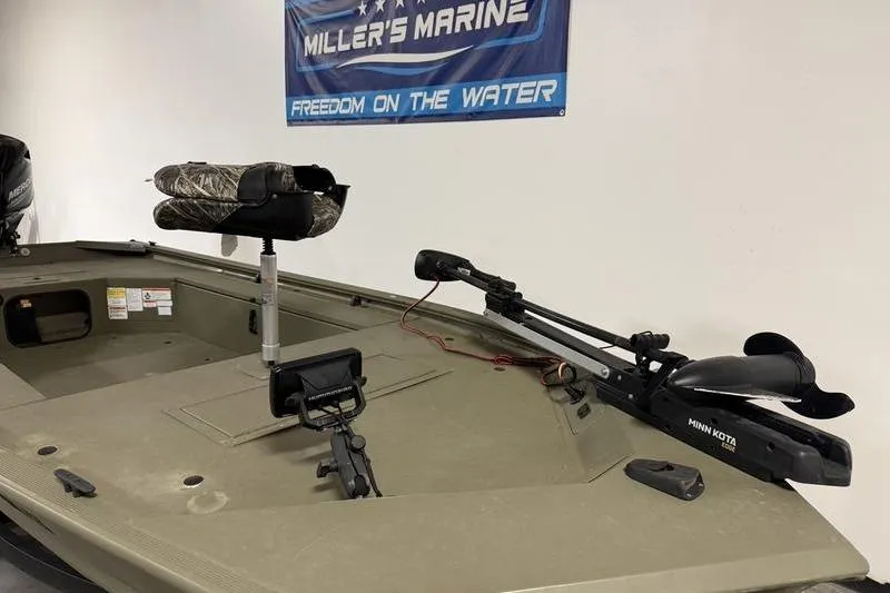 Slide: The Image of 2020 Tracker Grizzly 1548 T boat with Minn Kota trolling motor and camo seat. - 10