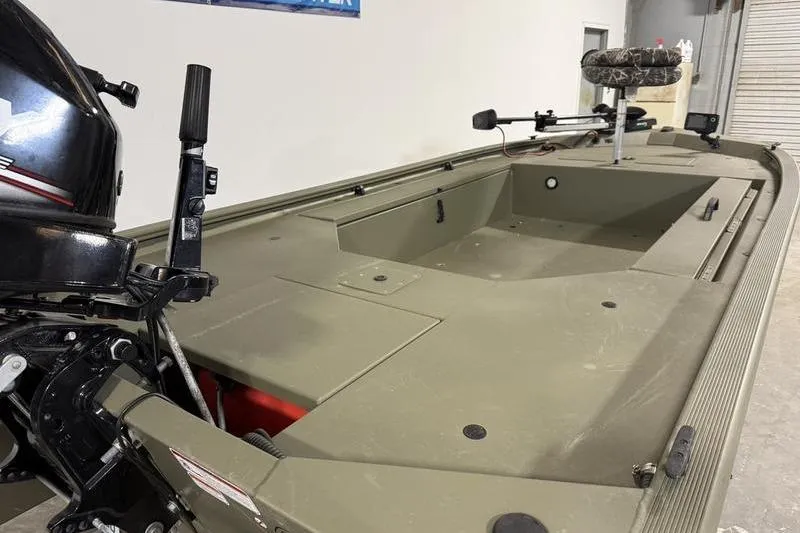 Slide: The Image of 2020 Tracker Grizzly 1548 T boat with motor, camo seat, and spacious deck. - 5
