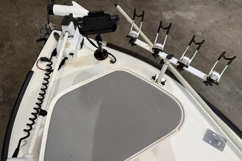 Slide: The Image of 2009 Beavertail Skiffs B2 boat deck with rod holders and trolling motor. - 11