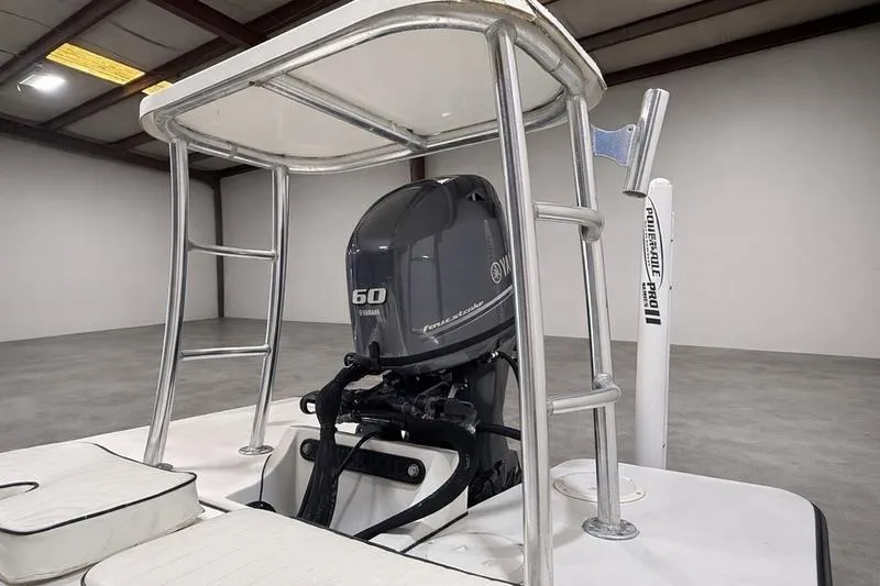 Slide: The Image of 2009 Beavertail Skiffs B2 with Yamaha 60 engine in a spacious indoor setting. - 4