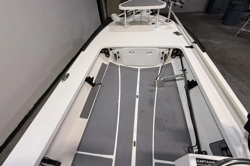 Slide: The Image of 2009 Beavertail Skiffs B2 interior view, featuring spacious deck and storage compartments. - 7