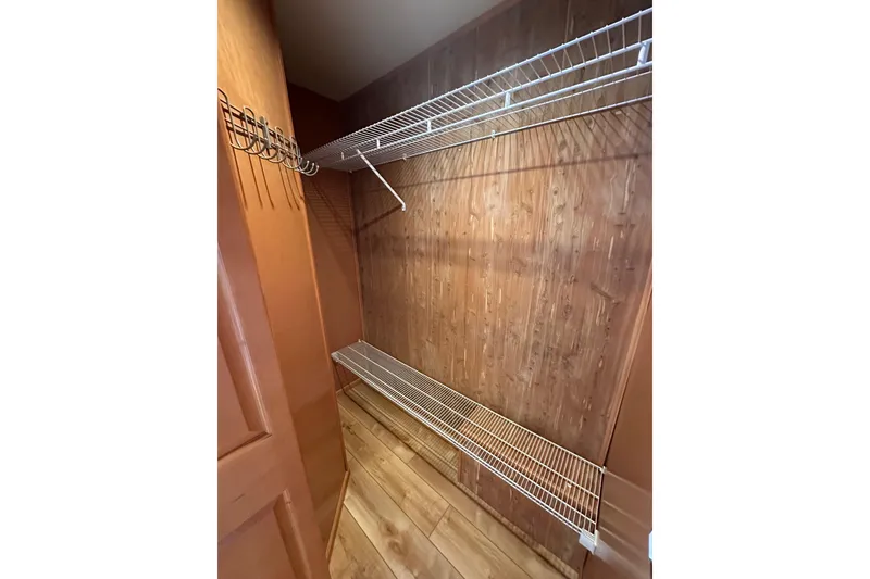 Slide: The Image of Empty wooden closet with wire shelving in 2004 Sumerset 16x82 model. - 16