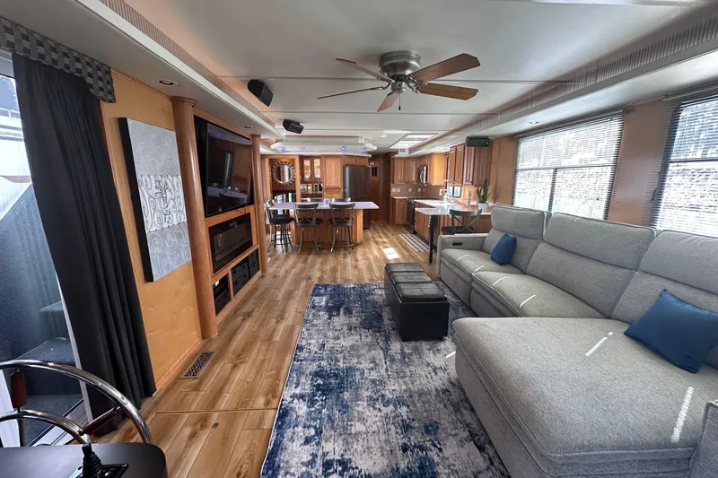 Slide: The Image of Luxurious 2004 Sumerset 16x82 houseboat interior with modern living area and kitchen. - 2