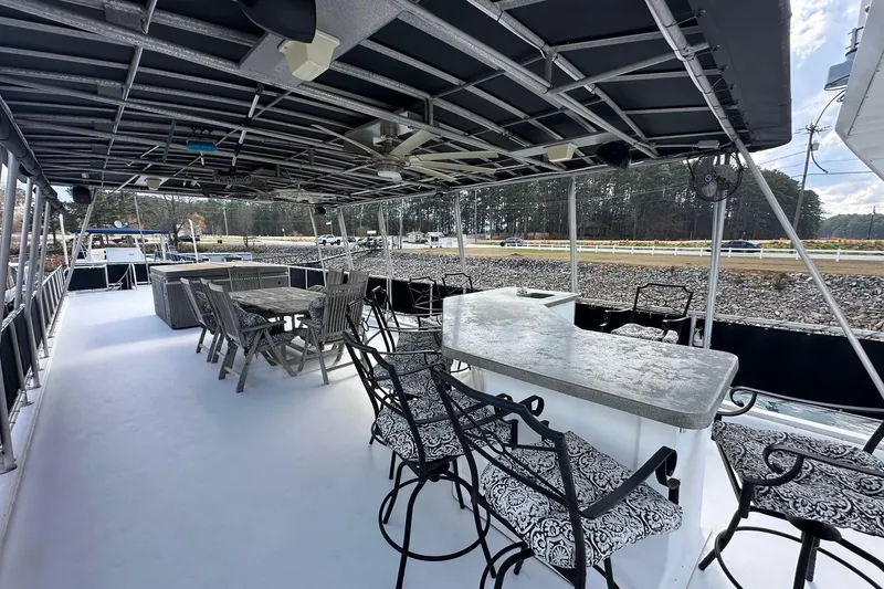 Slide: The Image of Luxurious 2004 Sumerset 16x82 houseboat with spacious outdoor seating and dining area. - 20