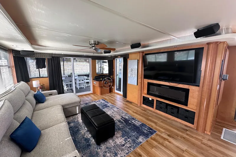 Slide: The Image of Luxurious 2004 Sumerset 16x82 houseboat interior with modern living area and entertainment center. - 3
