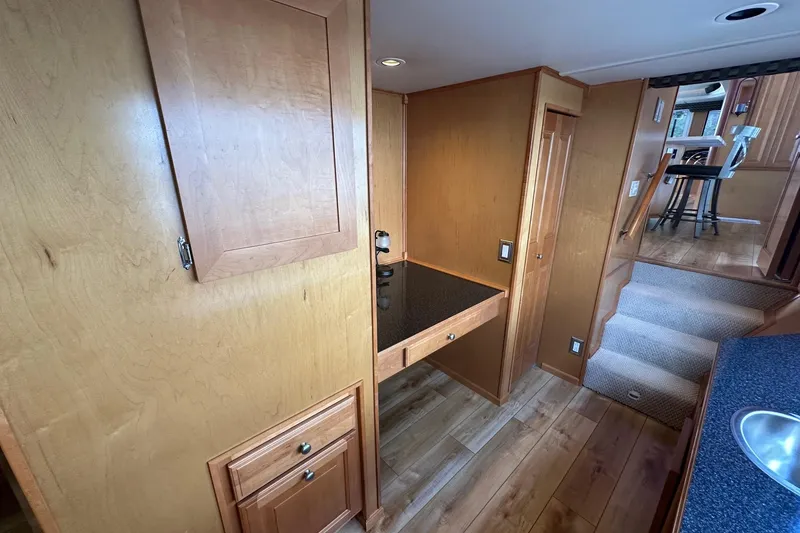 Slide: The Image of Interior of 2004 Sumerset 16x82 houseboat with wooden cabinetry and modern design. - 8