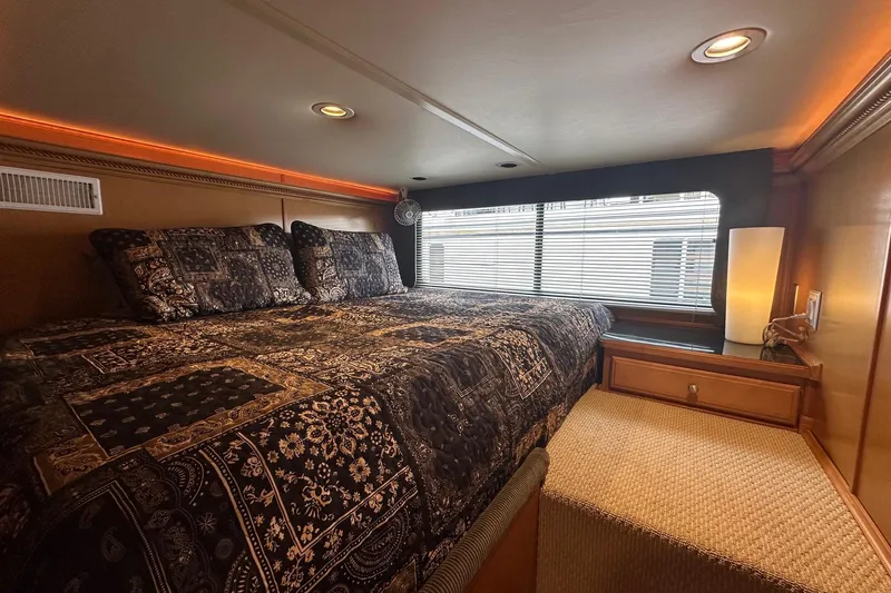 Slide: The Image of Luxurious bedroom interior in 2004 Sumerset 16x82 houseboat with elegant bedding and ambient lighting. - 9