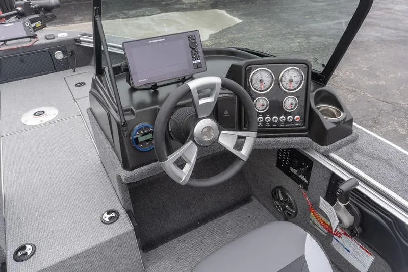 Slide: The Image of 2026 G3 Angler V1750 SF boat dashboard with steering wheel and modern gauges. - 13