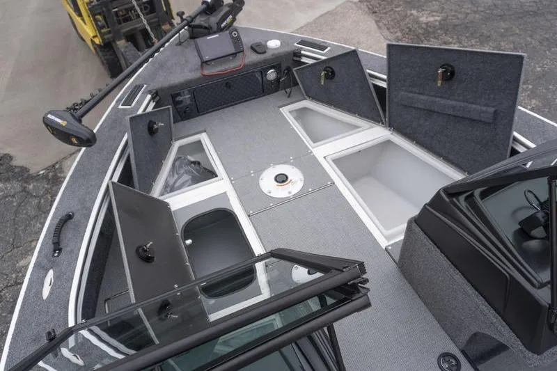Slide: The Image of 2026 G3 Angler V1750 SF boat interior with open storage compartments and fishing equipment. - 16