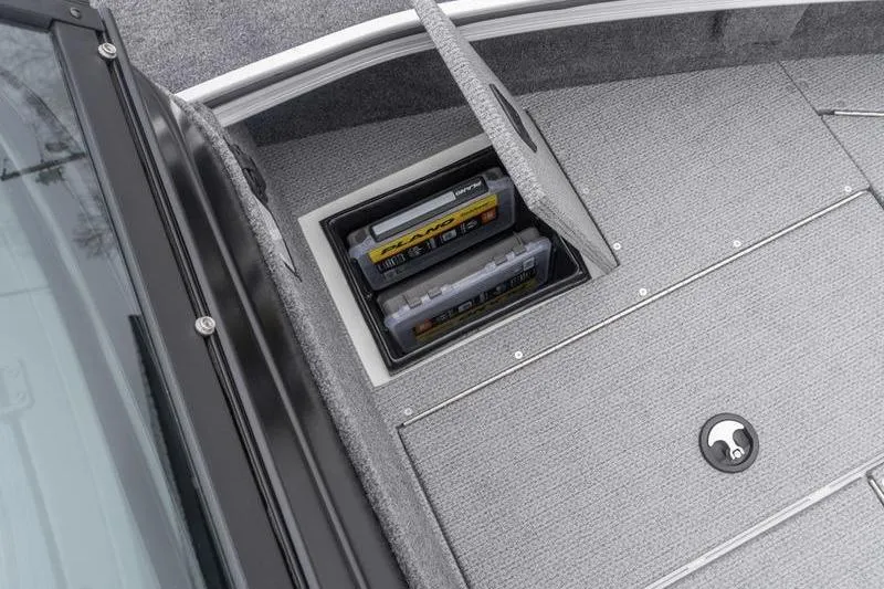 Slide: The Image of 2026 G3 Angler V1750 SF boat storage compartment with organized tackle boxes. - 18