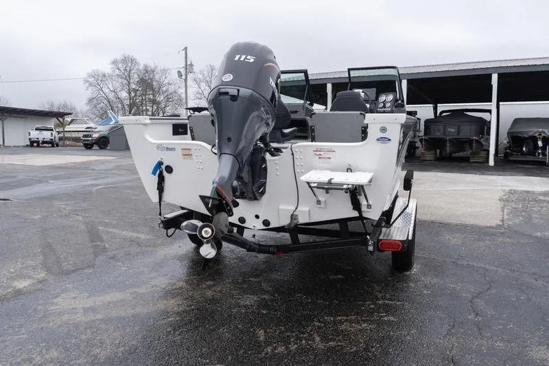 Slide: The Image of 2026 G3 Angler V1750 SF boat with 115 HP motor, parked outdoors. - 6