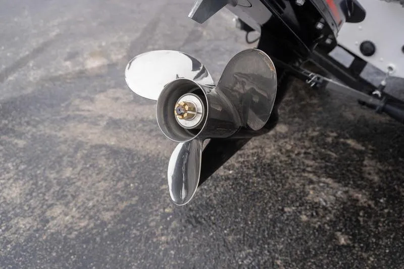 Slide: The Image of 2026 G3 Angler V1750 SF boat propeller on wet pavement. - 7