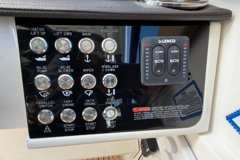 Slide: The Image of Control panel of a 2020 Sea Ray Sundancer 320 Outboard boat with various switches. - 10