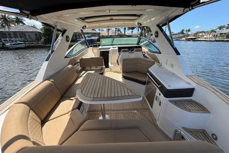 Slide: The Image of 2020 Sea Ray Sundancer 320 Outboard interior with luxurious seating and sleek design. - 15