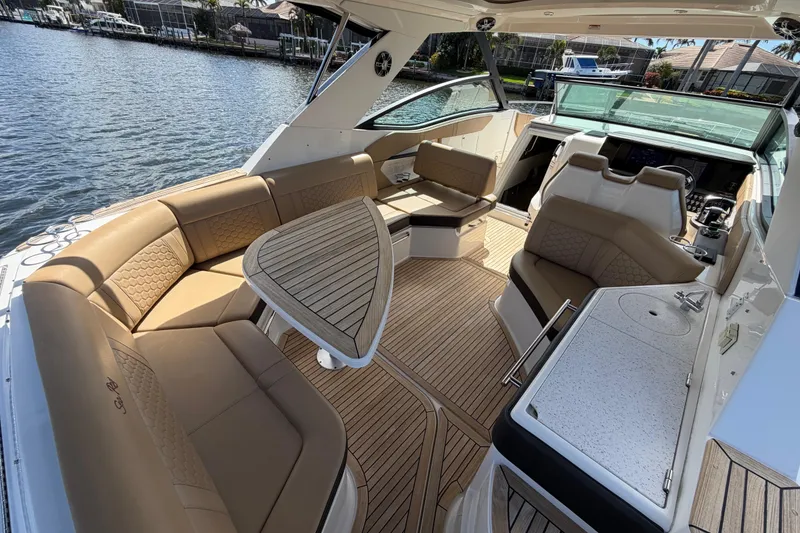 Slide: The Image of Luxurious 2020 Sea Ray Sundancer 320 Outboard interior with elegant seating and wooden accents. - 16