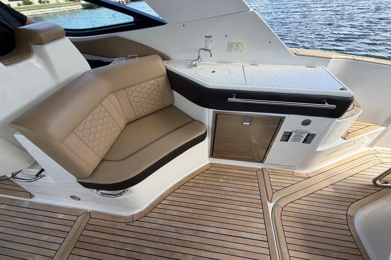 Slide: The Image of Luxurious interior of 2020 Sea Ray Sundancer 320 Outboard with seating and kitchenette. - 21
