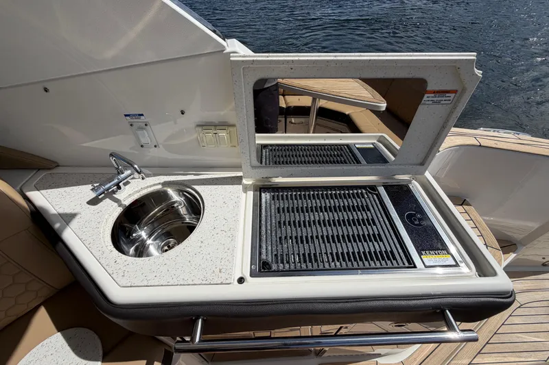 Slide: The Image of Outdoor kitchenette on 2020 Sea Ray Sundancer 320 Outboard with sink and grill. - 23