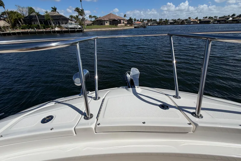 Slide: The Image of 2020 Sea Ray Sundancer 320 Outboard bow view on calm water, sunny day. - 27