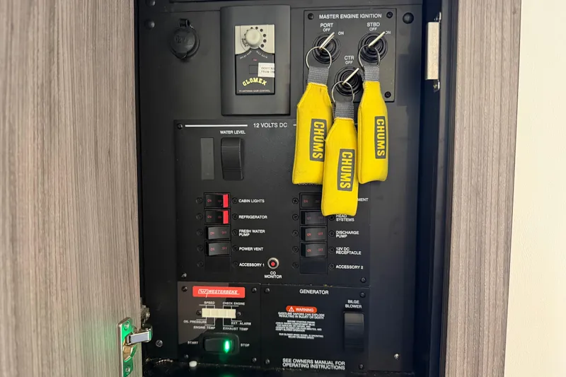 Slide: The Image of Control panel of a 2020 Sea Ray Sundancer 320 Outboard with ignition keys and switches. - 36