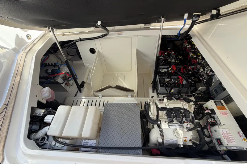 Slide: The Image of Engine compartment of 2020 Sea Ray Sundancer 320 Outboard, showcasing mechanical components. - 38