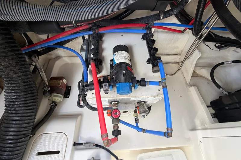 Slide: The Image of Engine compartment of 2020 Sea Ray Sundancer 320 Outboard with visible wiring and components. - 43