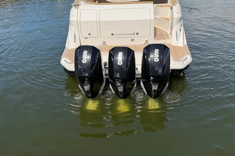 Slide: The Image of 2020 Sea Ray Sundancer 320 Outboard with triple engines on water. - 7