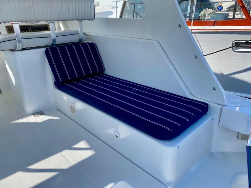 Slide: The Image of Interior of 2000 Mainship Pilot 34 with blue upholstery. - 13