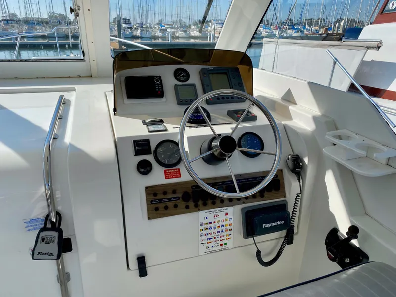 Slide: The Image of Helm of a 2000 Mainship Pilot 34 yacht in harbor. - 15