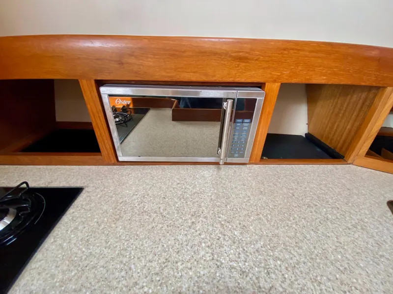 Slide: The Image of Mainship Pilot 34 kitchen area with microwave, year 2000. - 23