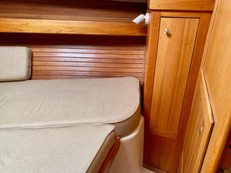 Slide: The Image of Interior of a 2000 Mainship Pilot 34 yacht with wooden finish. - 28