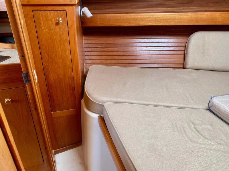 Slide: The Image of Interior of 2000 Mainship Pilot 34 with wooden furnishings. - 29