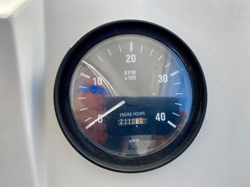 Slide: The Image of Tachometer of a 2000 Mainship Pilot 34 showing 2110 engine hours. - 38