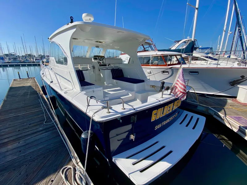 Slide: The Image of 2000 Mainship Pilot 34 boat docked at marina. - 7