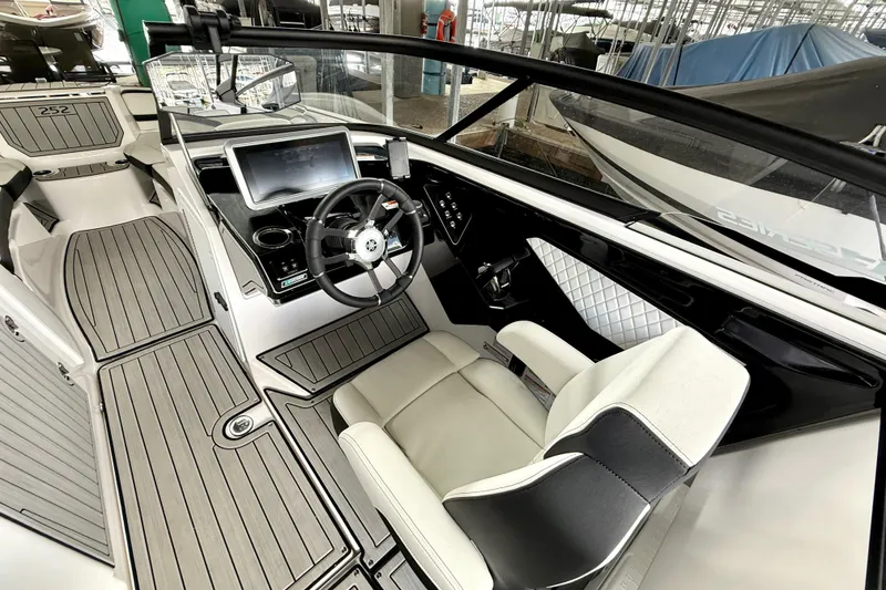 Slide: The Image of 2025 Yamaha Boats 252SE interior with modern dashboard and sleek seating design. - 22