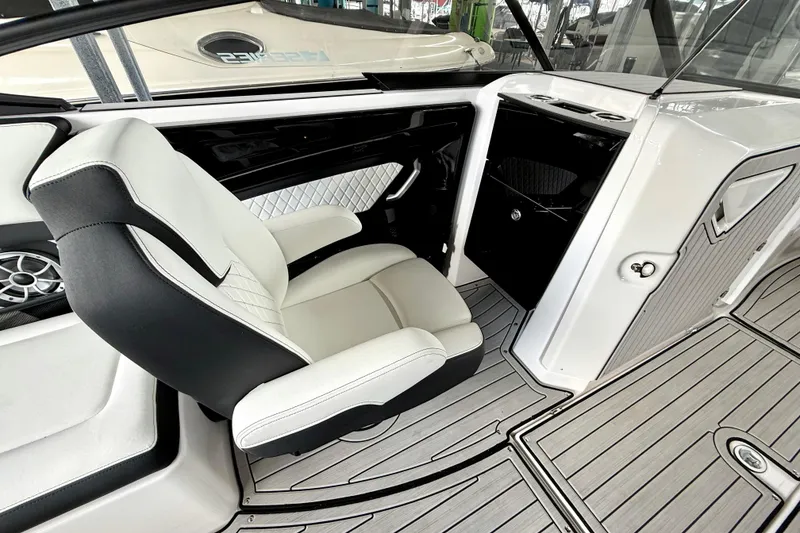 Slide: The Image of 2025 Yamaha Boats 252SE interior with luxury seating and modern design. - 23
