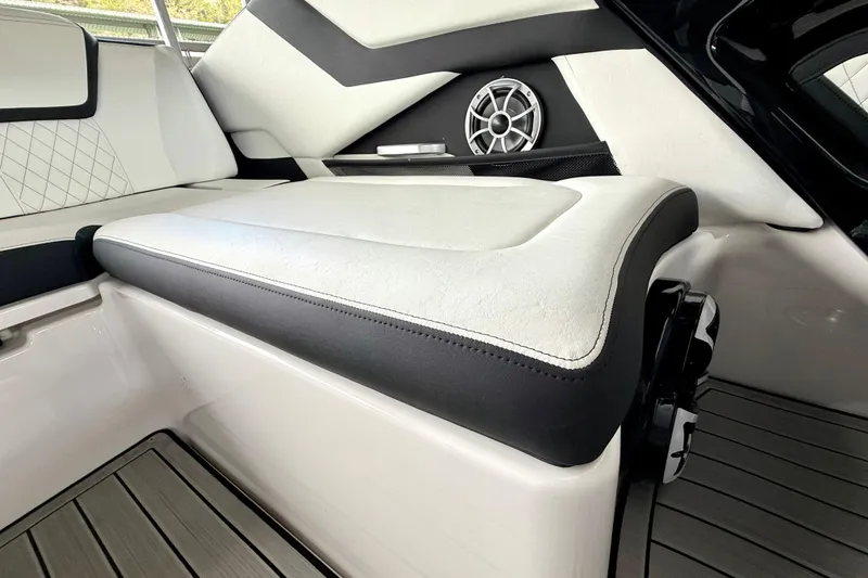 Slide: The Image of Interior seating of 2025 Yamaha Boats 252SE with speaker and modern design. - 24