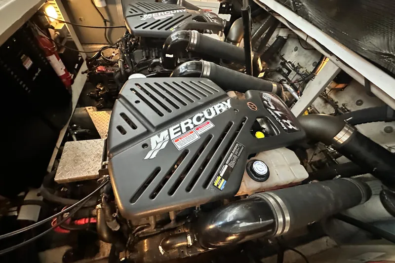 Slide: The Image of Engine room of a 2005 Sea Ray 360 Sundancer with twin Mercury engines. - 88
