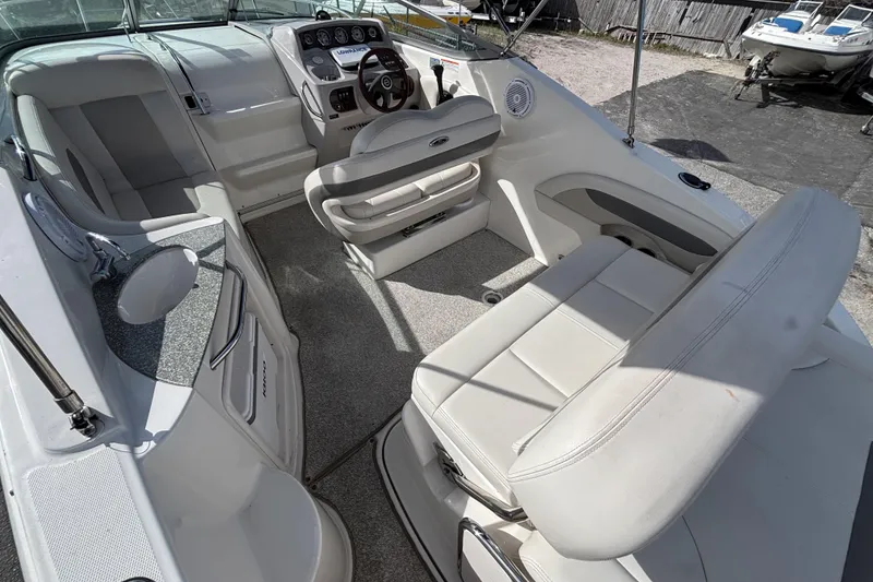 Slide: The Image of 2007 Chaparral Signature 250 boat interior with seating, steering console, and sink. - 11